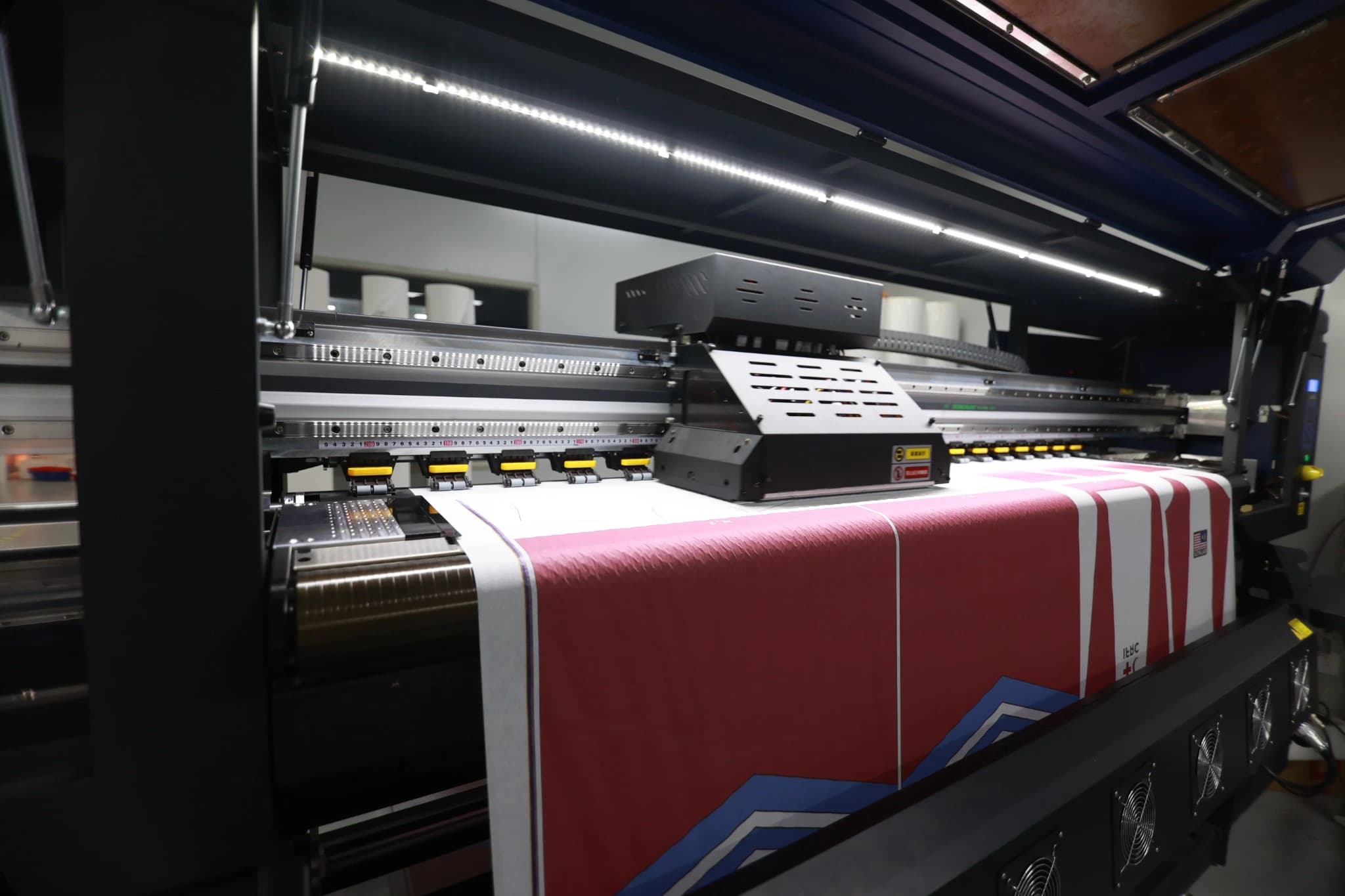Full-color sportswear designs on the output roll of a TONTON sublimation printer