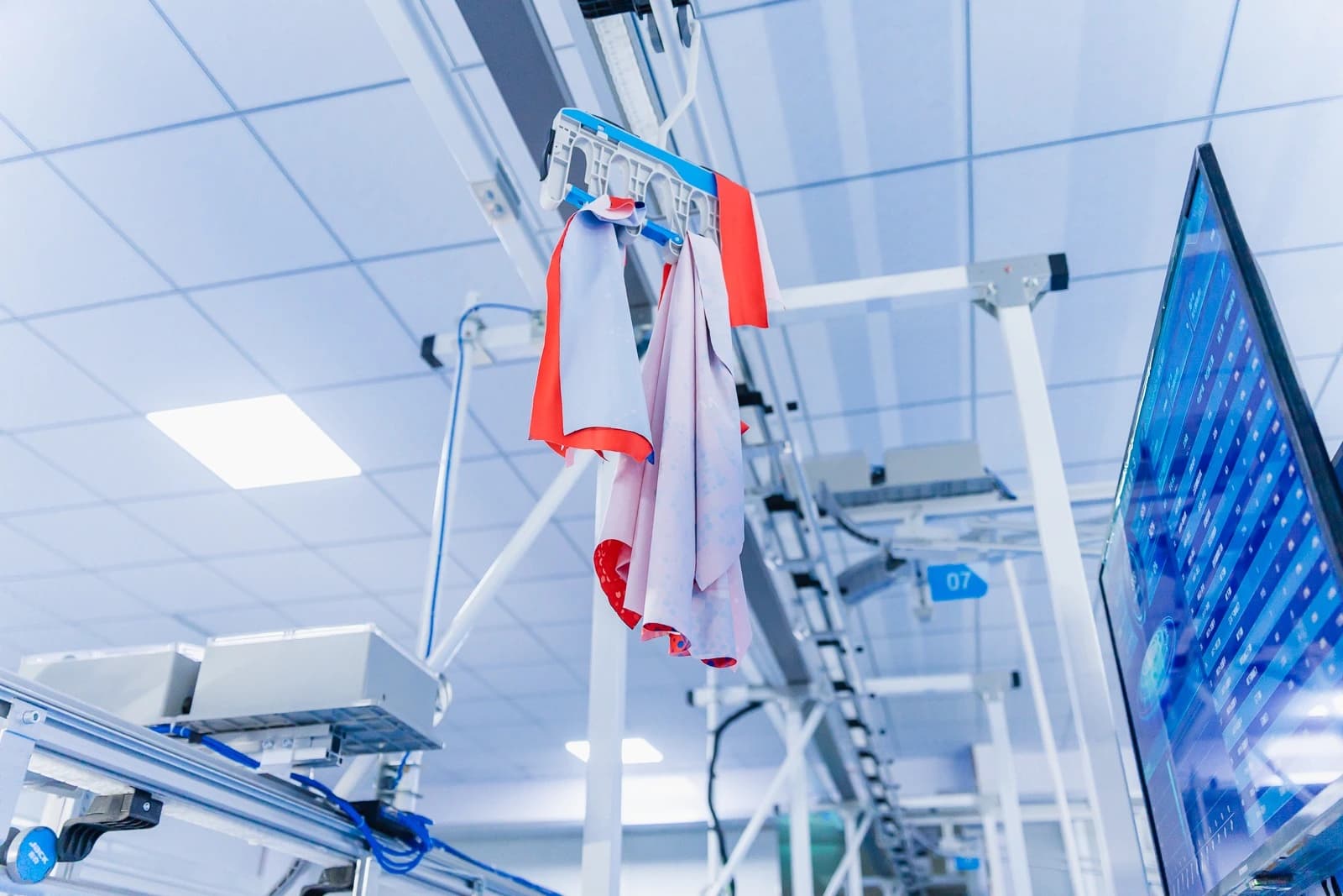 Garment carrier beside a production display at TONTON