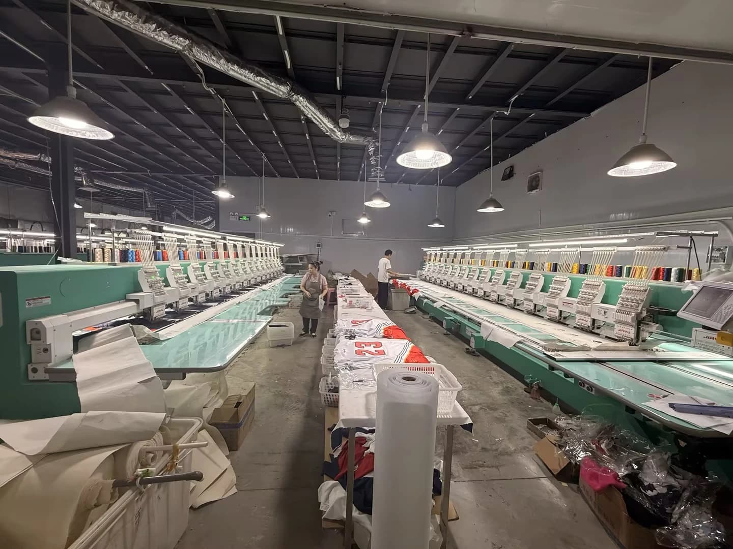 Central view between rows of TONTON embroidery equipment