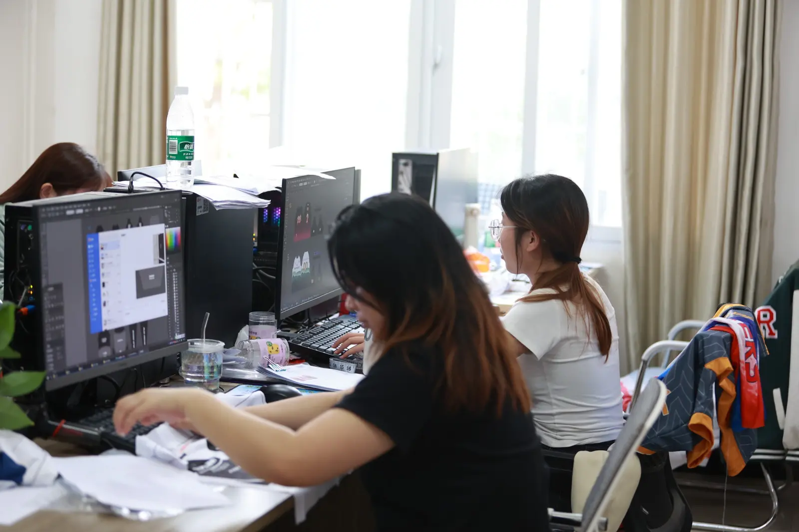 Designer preparing custom sportswear artwork and product layout