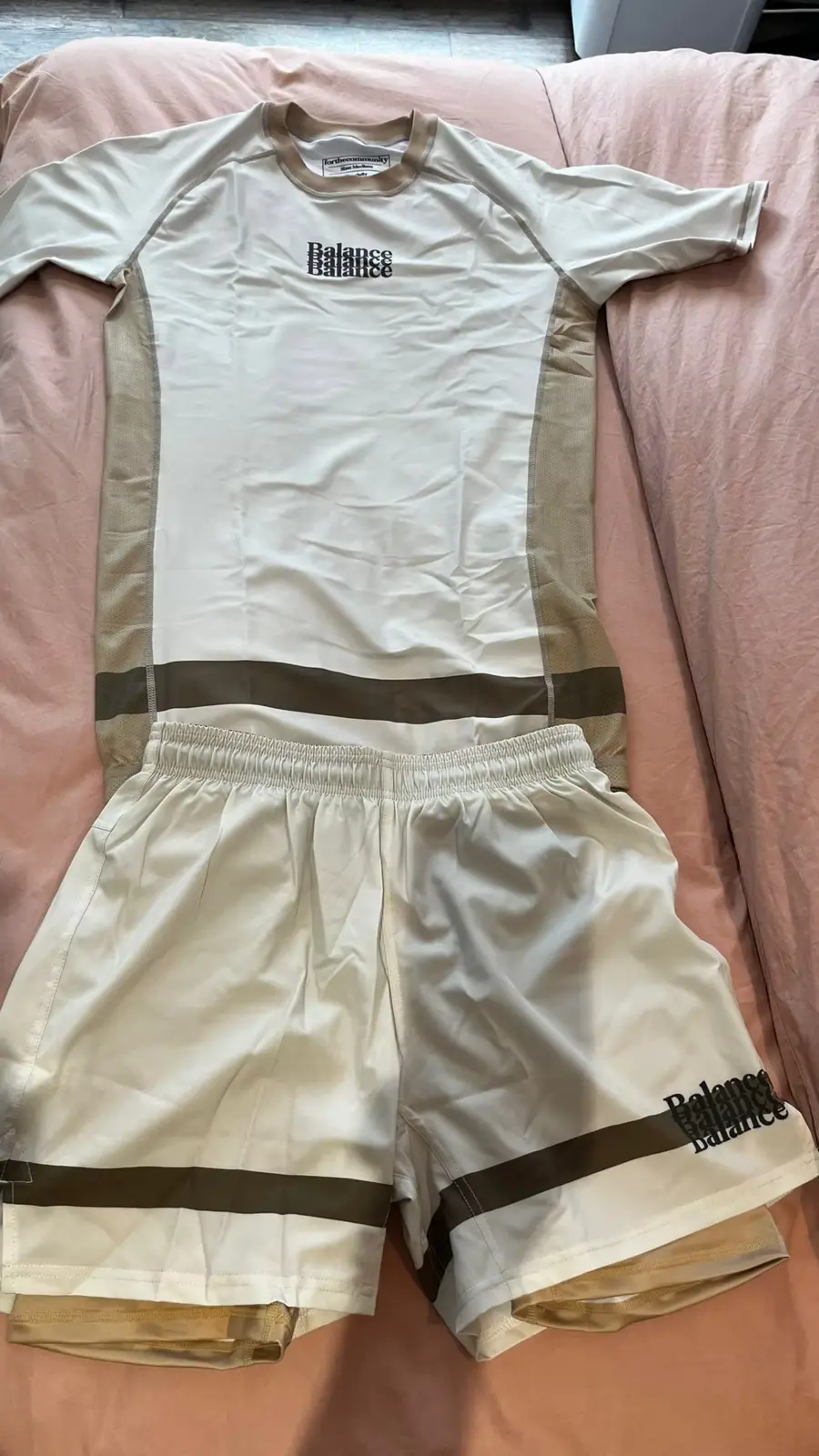 Customer-supplied photograph of a coordinated custom training shorts and top set
