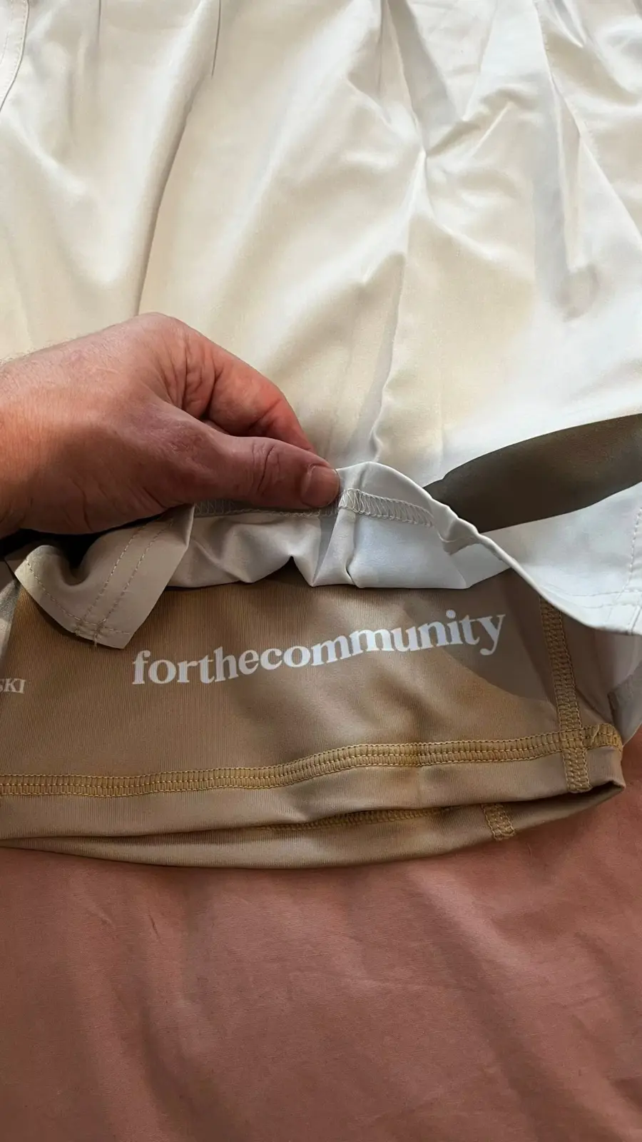 Customer-supplied close-up of layered custom fight shorts construction