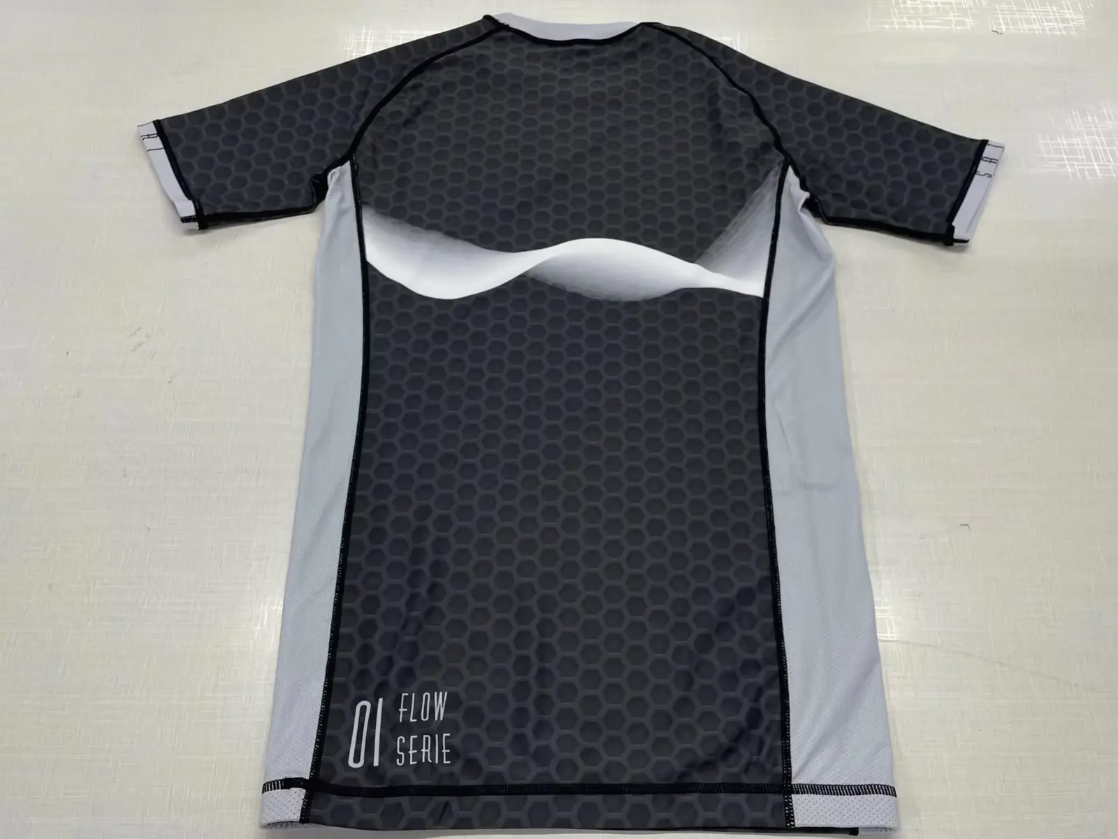 Customer-supplied rear photo of a finished Satori short-sleeve Rash Guard