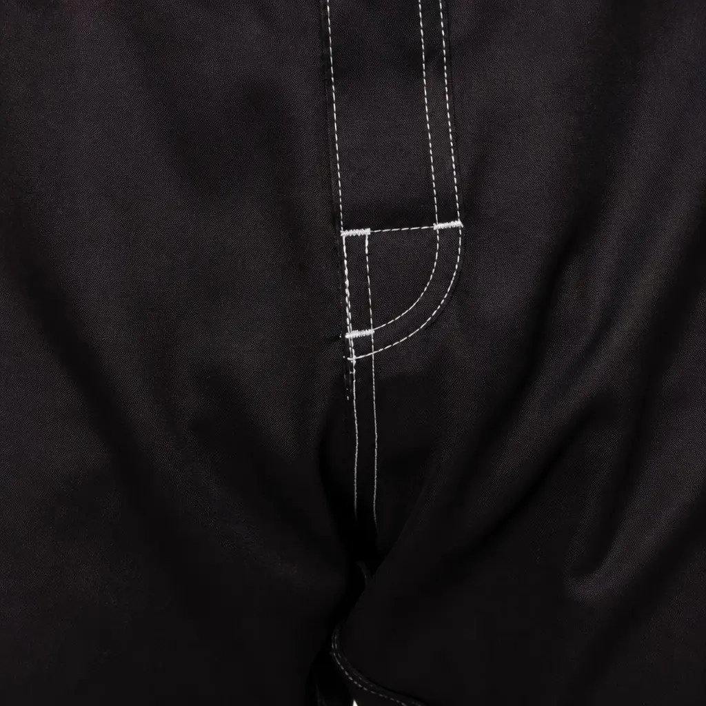 Curved front-crotch panel and contrast topstitching on short-cut MMA fight shorts