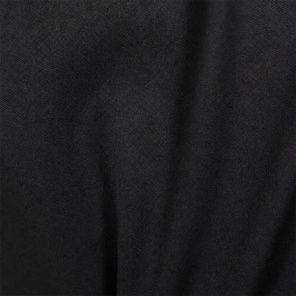Close-up of smooth matte black fabric used as a custom MMA fight shorts development reference