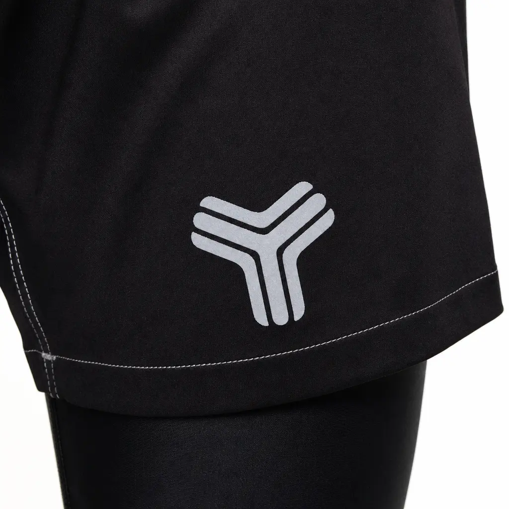 Reinforced hem, grey leg logo and separate compression tights beneath black MMA fight shorts