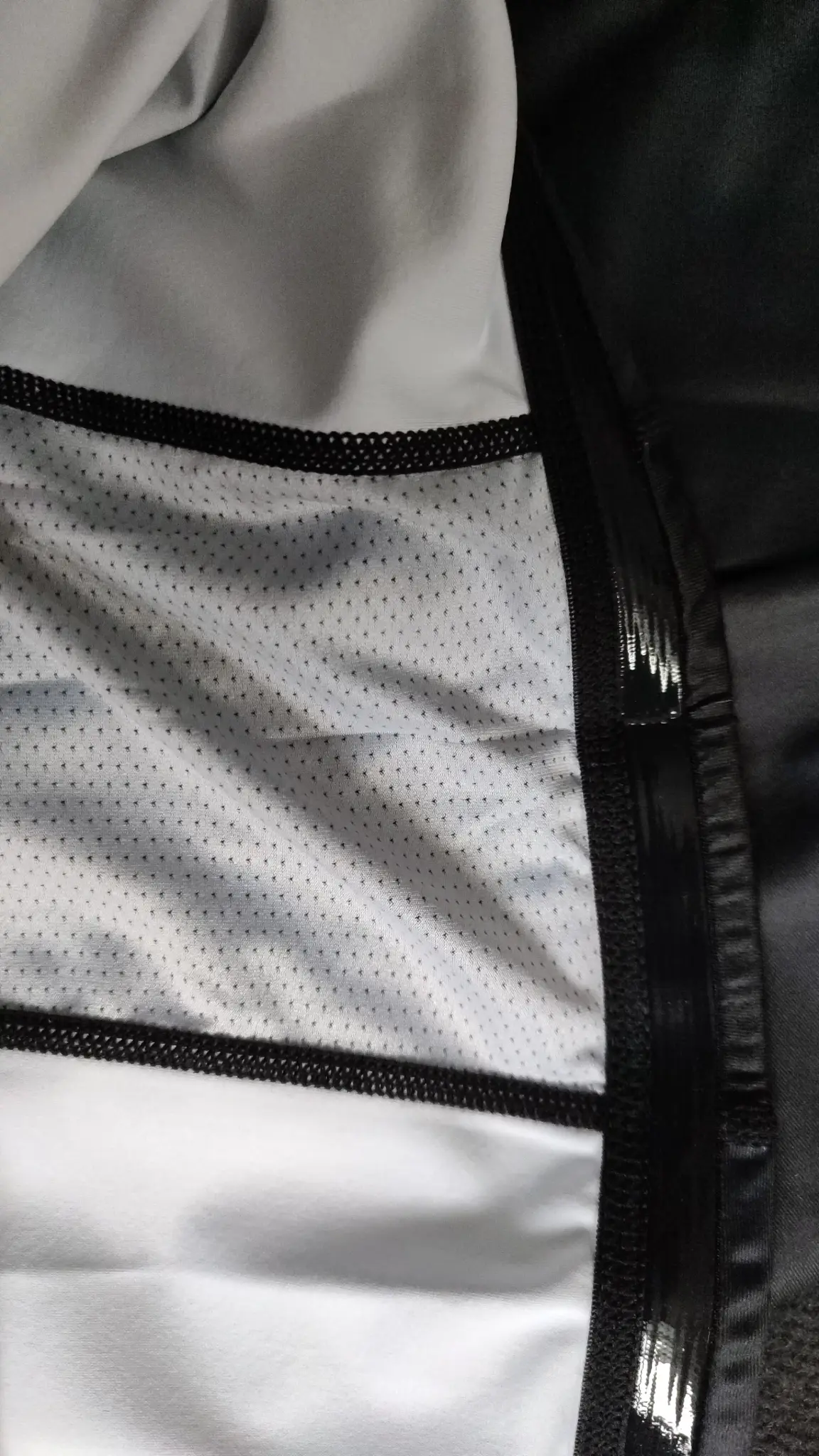 Close-up of breathable mesh panel joined to Rash Guard fabric