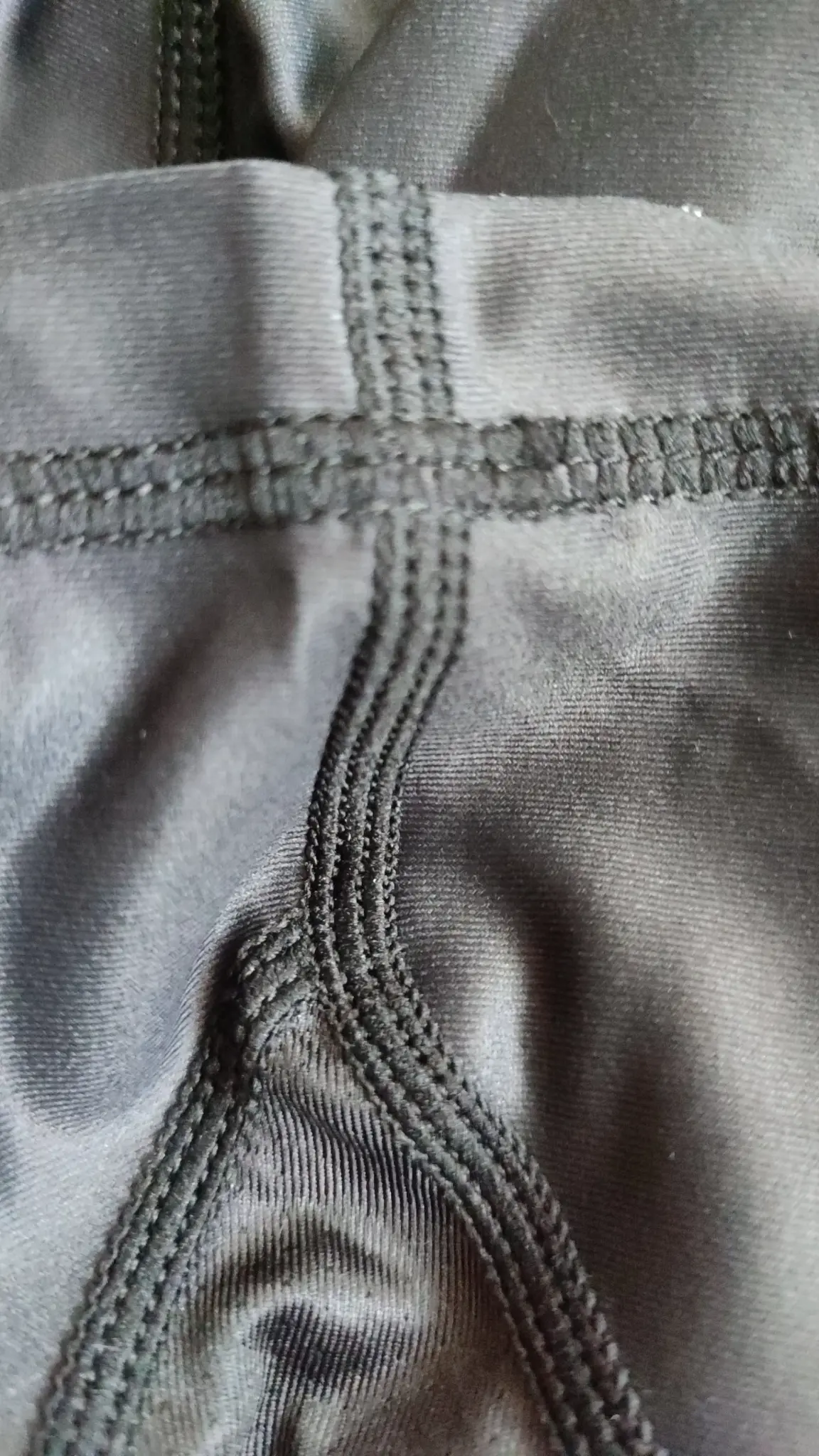 Reinforced Rash Guard seam junction on a real garment sample