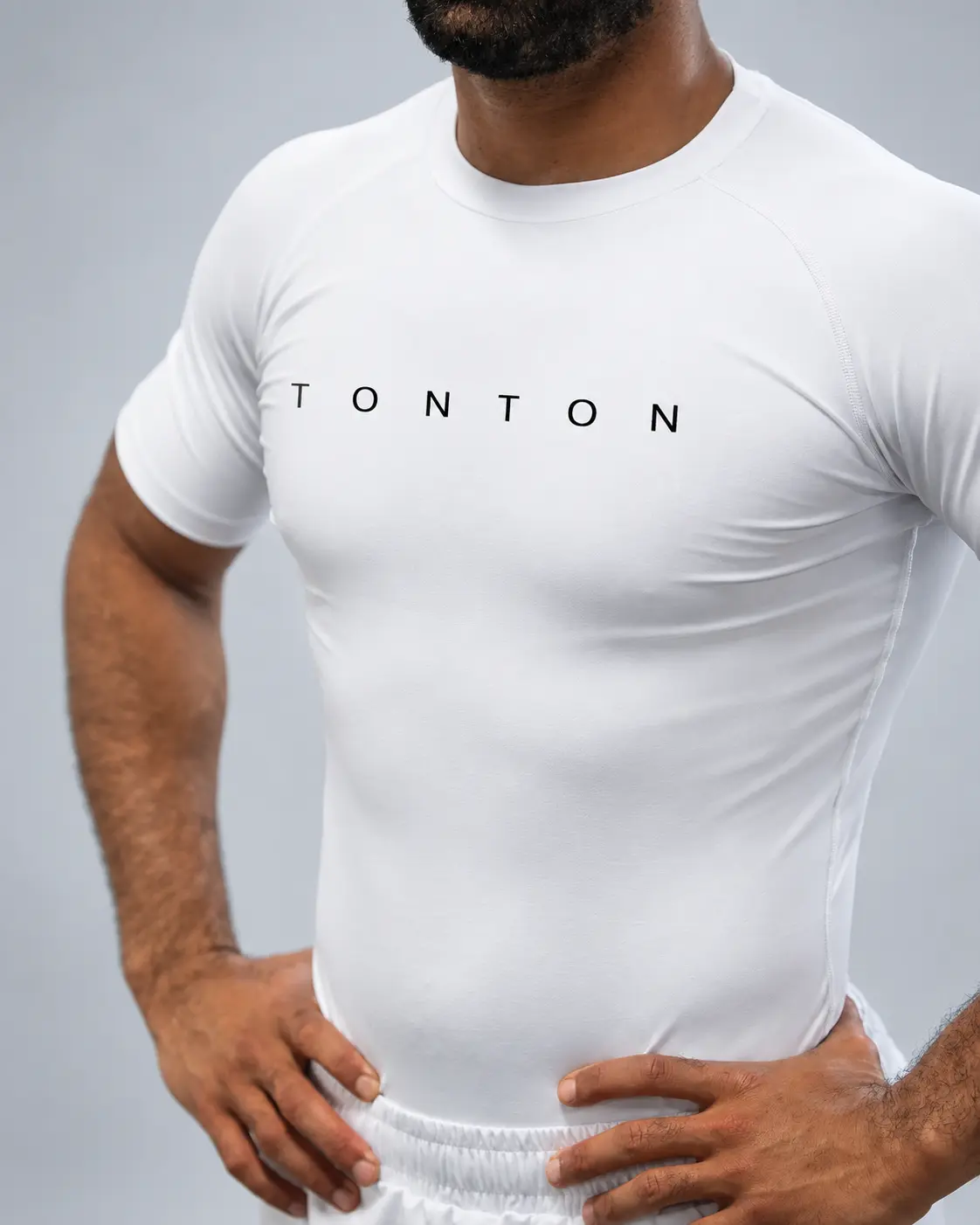 White custom short-sleeve TONTON Rash Guard on a model