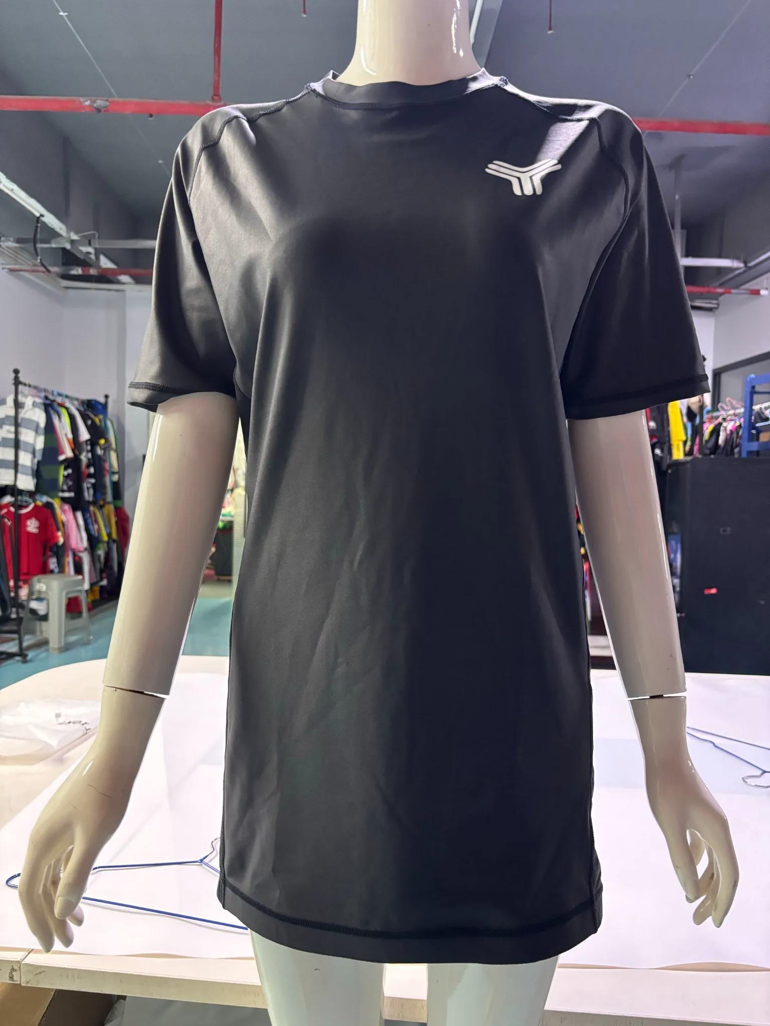 Front view of a custom short-sleeve Rash Guard showing performance fabric, raglan panels and athletic fit