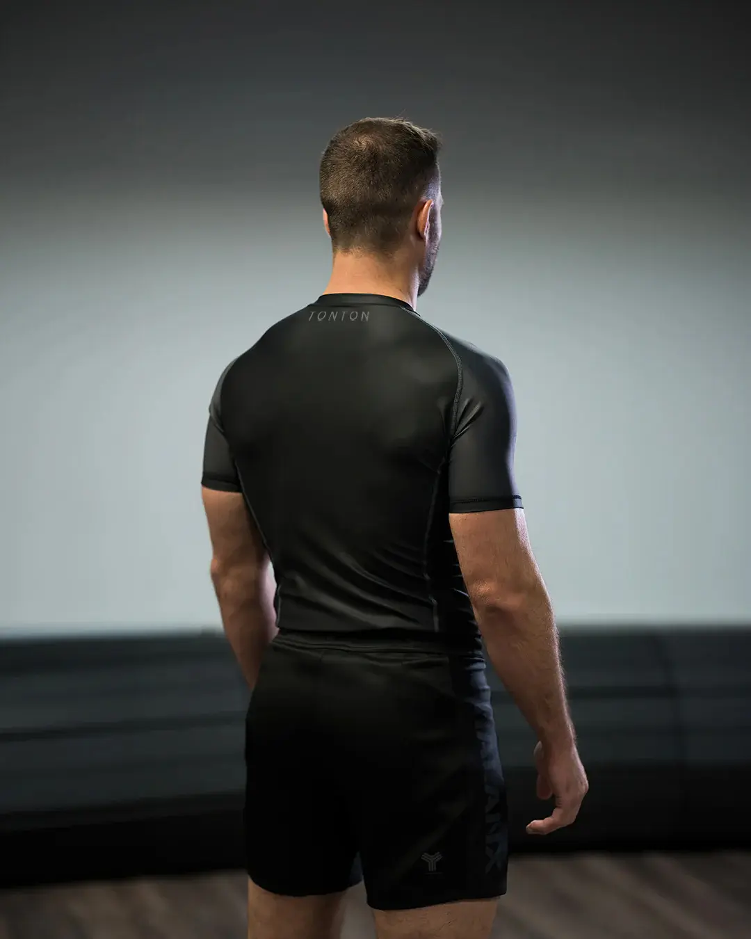 Black short-sleeve custom Rash Guard rear fit and back panel view