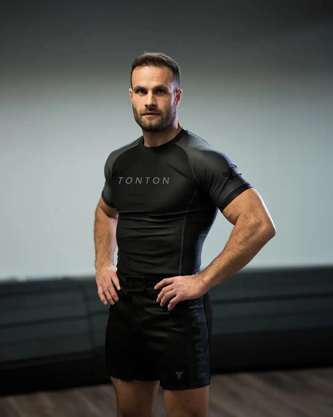 Black short-sleeve compression Rash Guard three-quarter front view