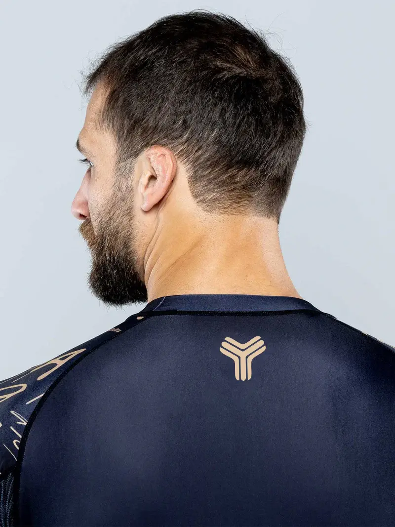 Back-neck logo detail on a custom long-sleeve Rash Guard