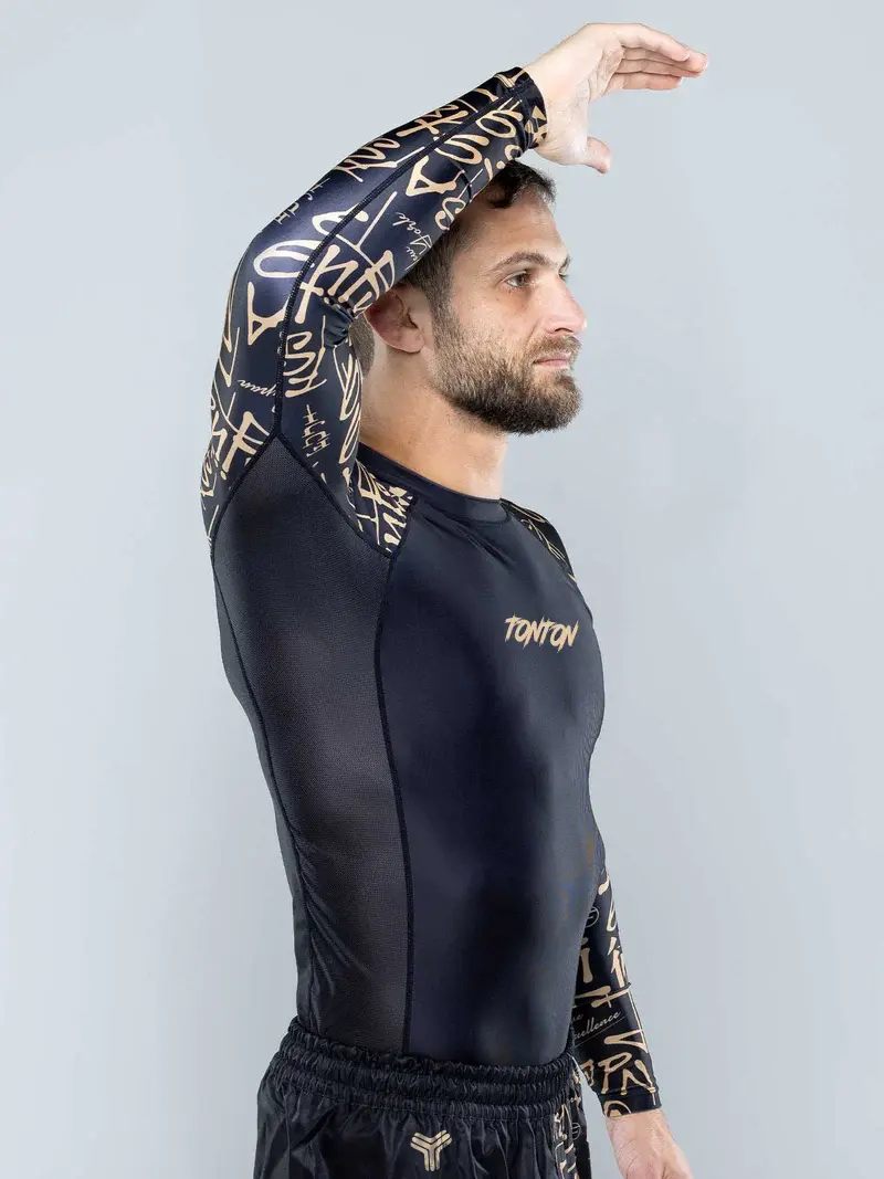 Athlete demonstrating overhead mobility in a long-sleeve Samurai Rash Guard