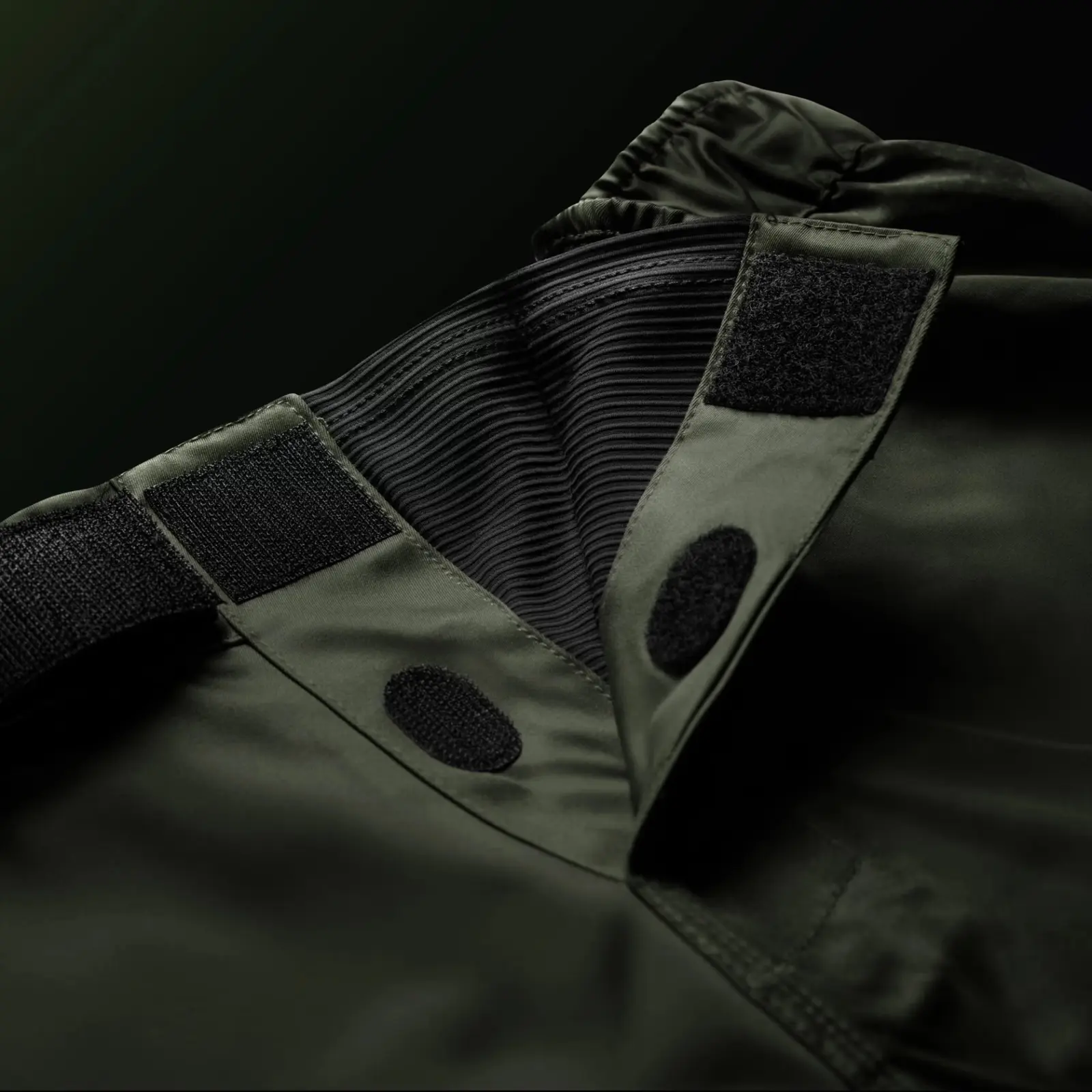 Adjustable waistband construction on functional training shorts