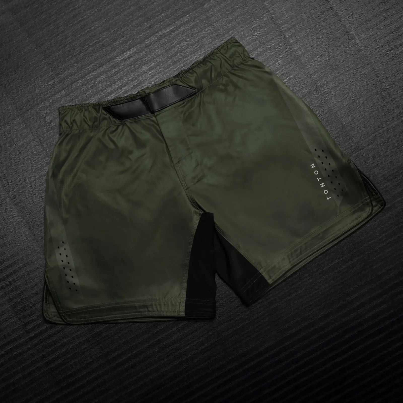 Front overview of olive functional training shorts with adjustable waist, ventilation and contrast panels
